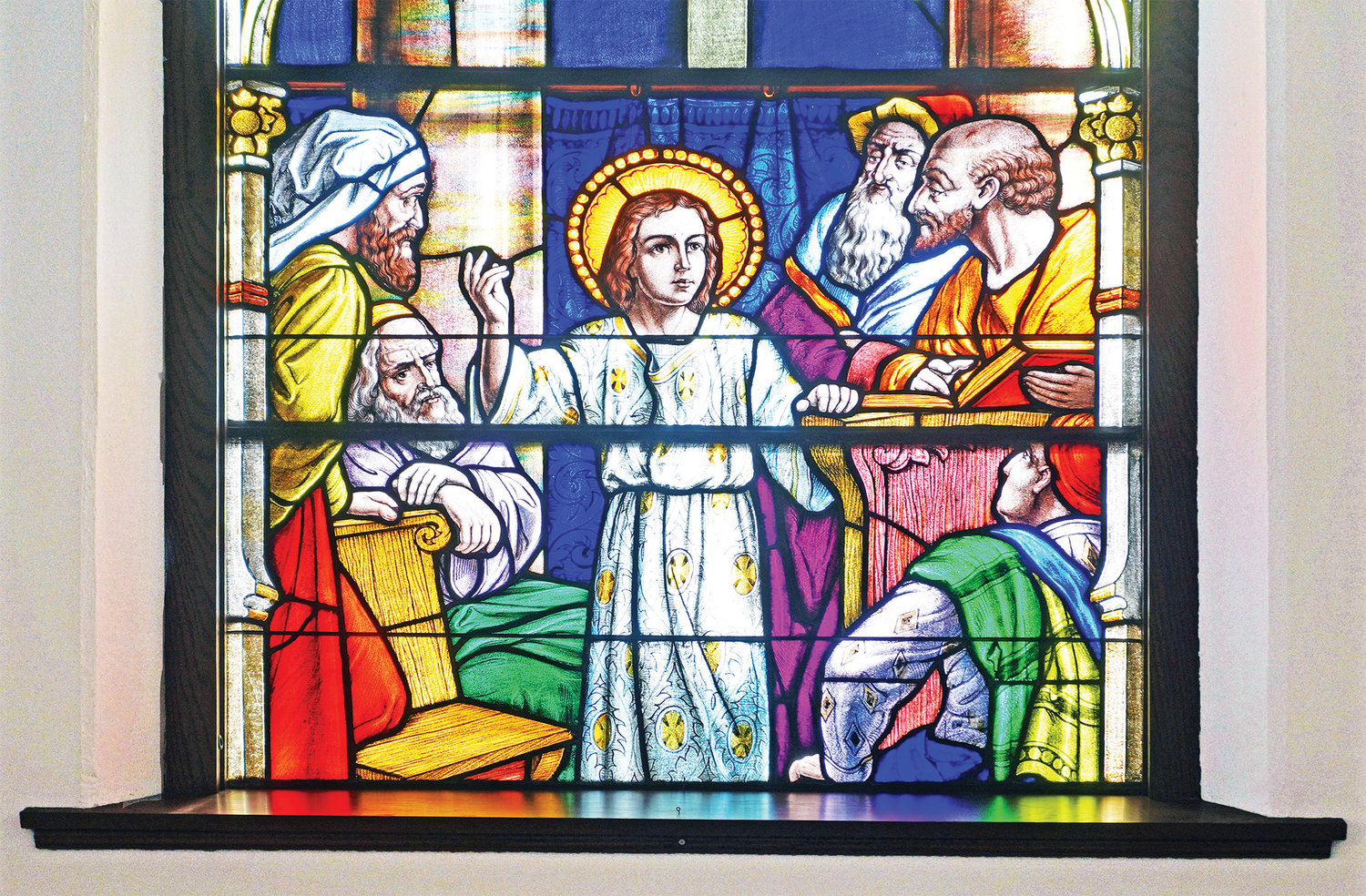 The teachers in the Temple listen to the child Jesus, in this stained glass depiction in St. Thomas the Apostle Church in St. Thomas. “All who heard Him were astounded at His understanding and His answers” (Luke 2:47). Pope Francis is confident that the Holy Spirit will inspire people of all stations in life to help discern God’s will for the Church through the preparations for the Synod of Bishops.